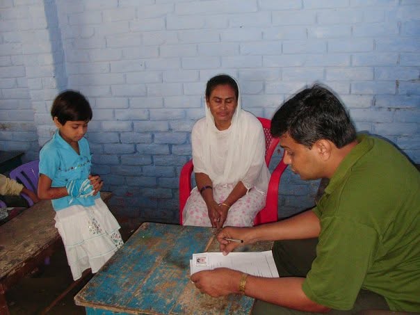Parvaaz Foundation founders conducting door-to-door community outreach